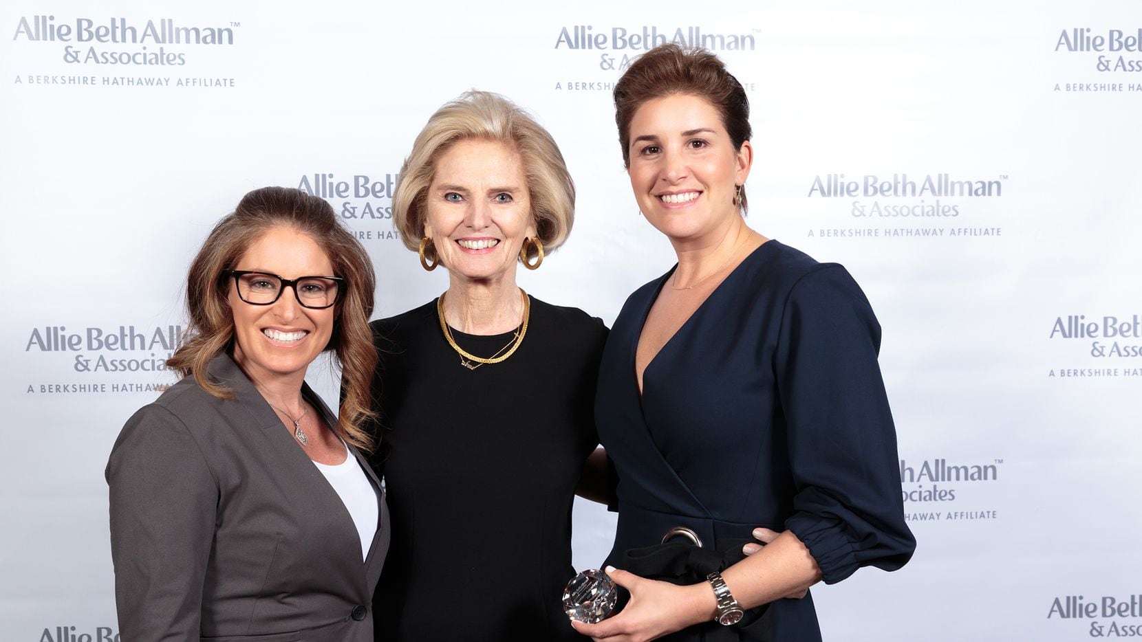 From left, Julie Haymann, president/CEO Allie Beth Allman and Lauren Savariego celebrate the...