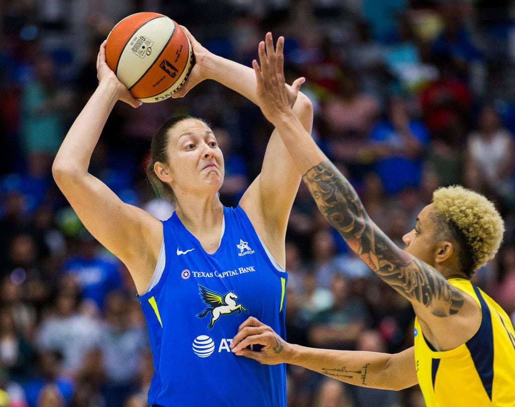 Dallas Wings forward Theresa Plaisance (55) looks for a pass over Indiana Fever forward Candice Dupree (4) during the first quarter of a WNBA game between the Dallas Wings and the Indiana Fever on Friday, July 5, 2019 at UTA's College Park Center in Arlington. (Ashley Landis/The Dallas Morning News)
