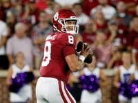 Oklahoma quarterback Dillon Gabriel (8) looks for a receiver against Kansas State in the...