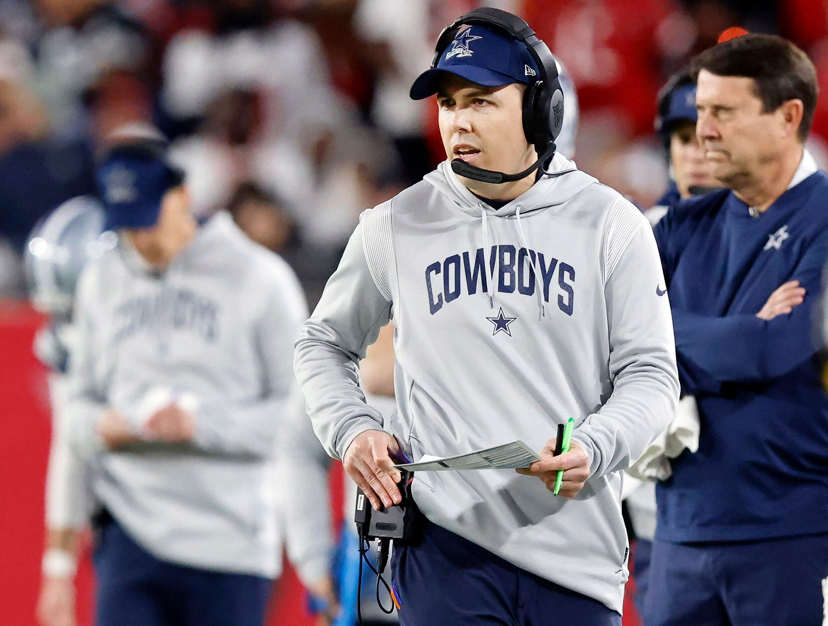 Dallas Cowboys offensive coordinator Kellen Moore paces the sideline during the second half...