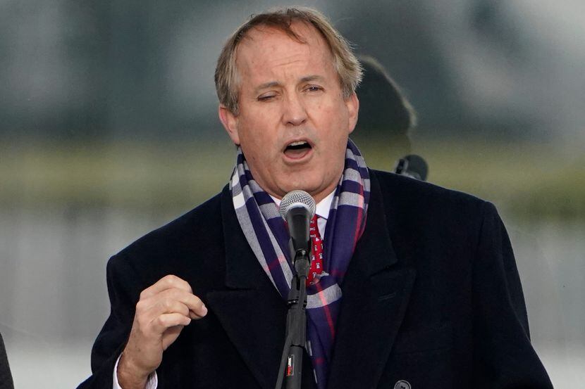 Texas Attorney General Ken Paxton speaks in Washington, at a rally in support of President...