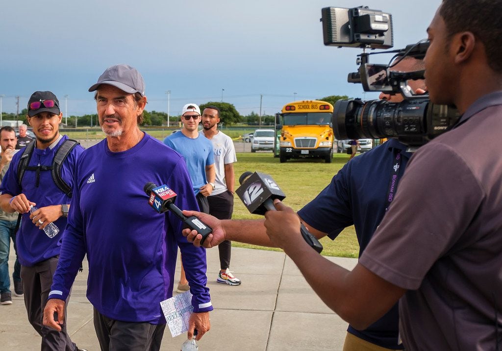 Art Briles talks to reporters after getting off the team bus before his team's season-opening game on Friday, Aug. 30, 2019. (Smiley N. Pool/The Dallas Morning News)