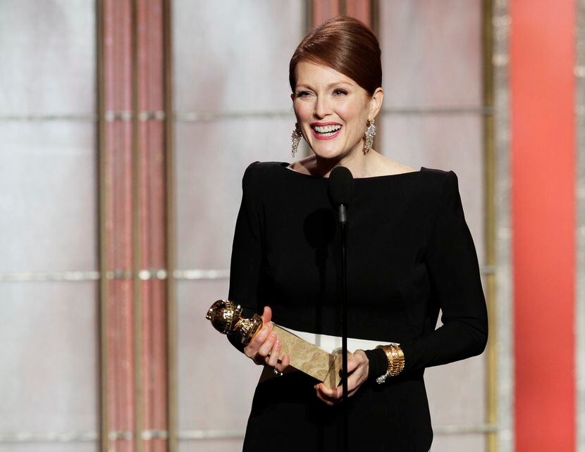 In this Jan. 13, 2013 photo, Julianne Moore, winner of the award for best actress in a...