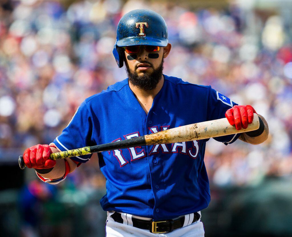 Texas Rangers second baseman Rougned Odor (12) walks back to the dugout after striking out...