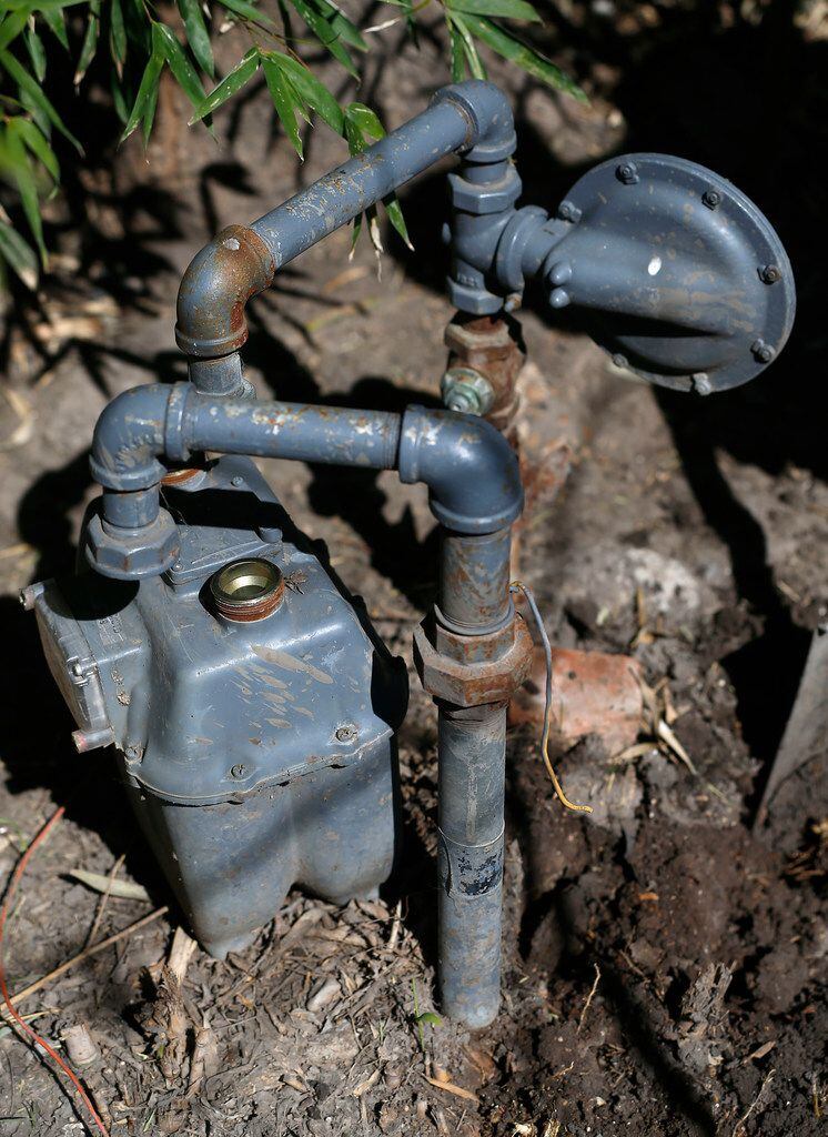 A gas meter is detached from an old gas pipe in the backyard of Elodia Gutierrez's house on...
