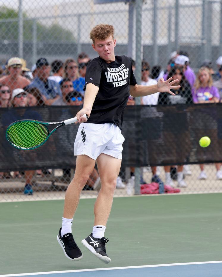 Plano West’s Dmitri Goubin jumps to hit a shot during the 6A mixed doubles championship...