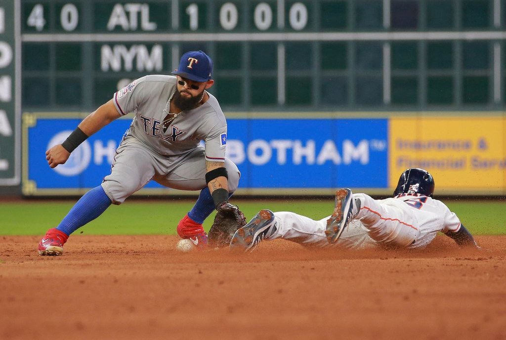 Houston Astros' Myles Straw steals second base ahead of the throw to Texas Rangers Rougned...