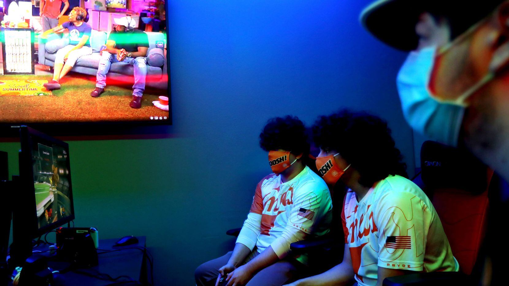 From left, Chaynen Casas, Marcel Hayek and Sean Fox of the Super Smash Bros team play at the...