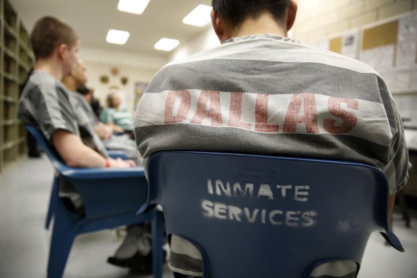 Inmates at the Dallas County Jail listen to Dallas County Judge Clay Jenkins and Bishop T.D....