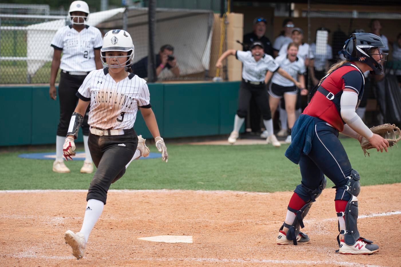 Bishop Lynch senior Alexa Gaytan (3) sprints across home plate to score during the TAPPS...