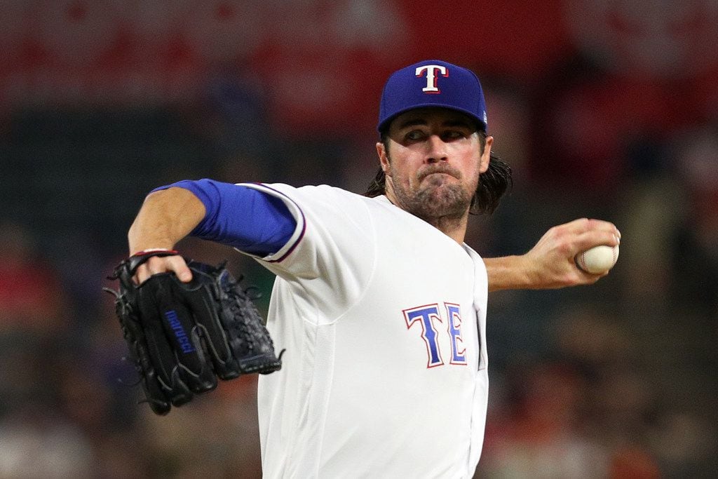 ARLINGTON, TX - SEPTEMBER 26:  Cole Hamels #35 of the Texas Rangers delivers a pitch in the...