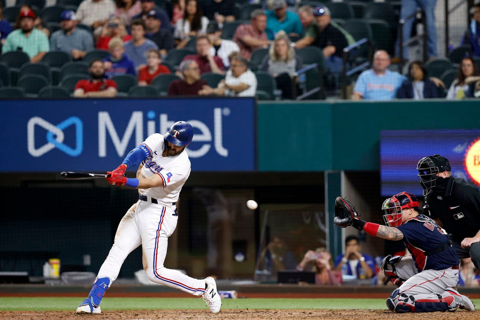 Texas Rangers batter Joey Gallo swings and misses a Boston Red Sox pitch during an eighth...