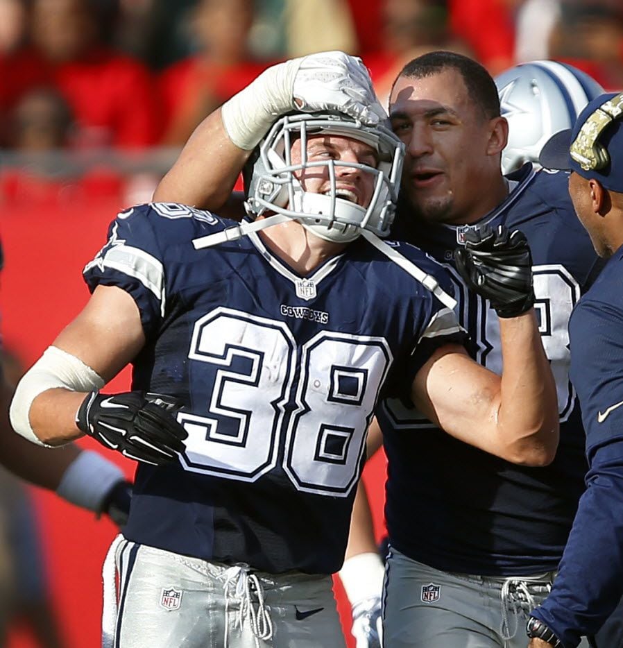 Dallas Cowboys strong safety Jeff Heath (38) is congratulated by teammate Ryan Russell (99)...