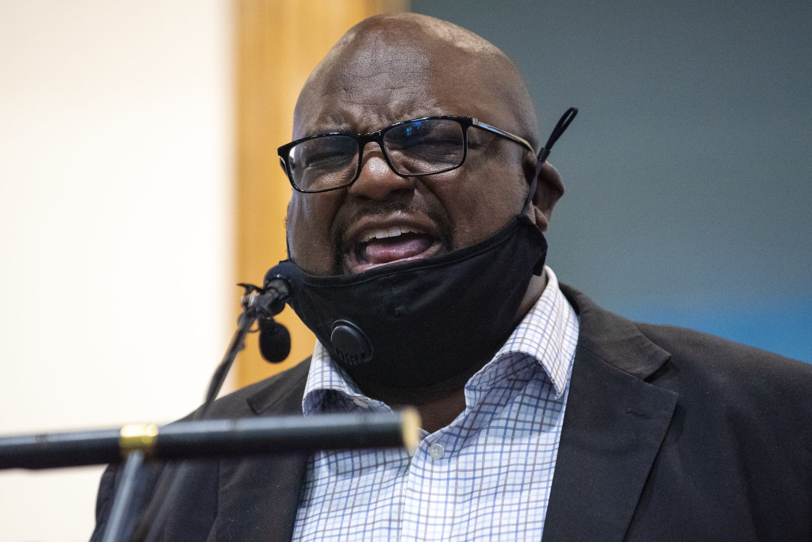 J.K. Hamilton, minister at Mountain View Church of Christ, conducts a prayer at the event.