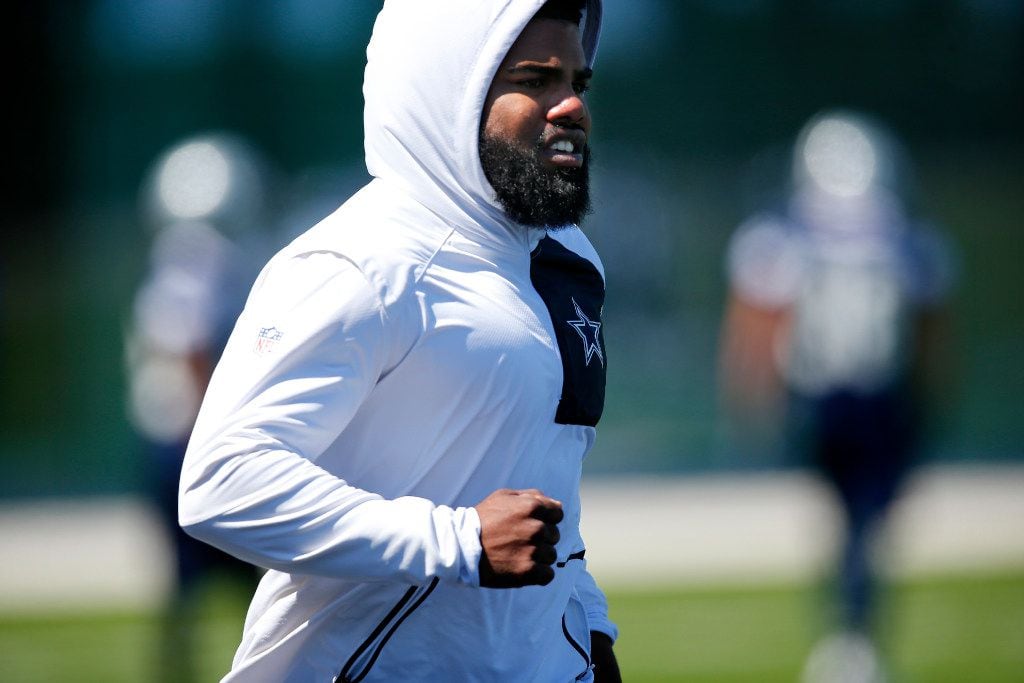 Dallas Cowboys running back Ezekiel Elliott (21) jogs during organized team activities at The Star in Frisco, Texas, Wednesday, May 24, 2017. Elliott was limited due to soreness following a car accident. (Tom Fox/The Dallas Morning News)