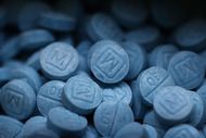Fentanyl pills that imitate Oxycodone M30 are shown at the Drug Enforcement Administration's...