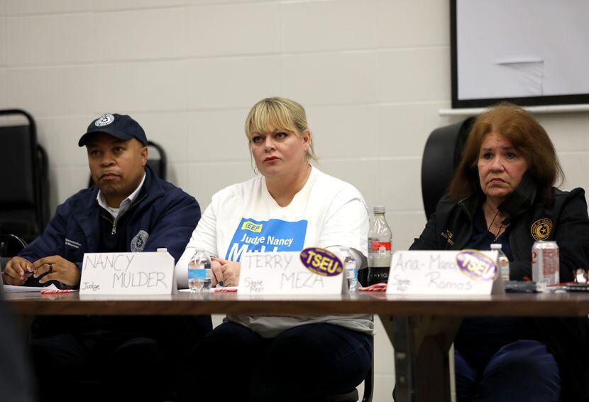 Dallas County criminal court Judge Nancy Mulder (center), listened to speakers at Saturday's...