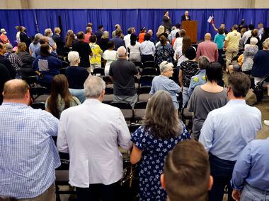 Texas Democratic Party Chairman Gilberto Hinojosa (center, at podium) leads the SDEC (State...