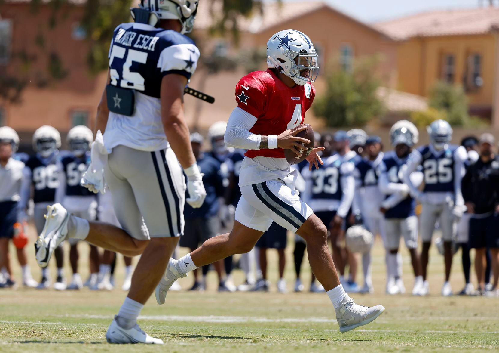 Dallas Cowboys quarterback Dak Prescott (4) keeps the ball and runs in for a touchdown...