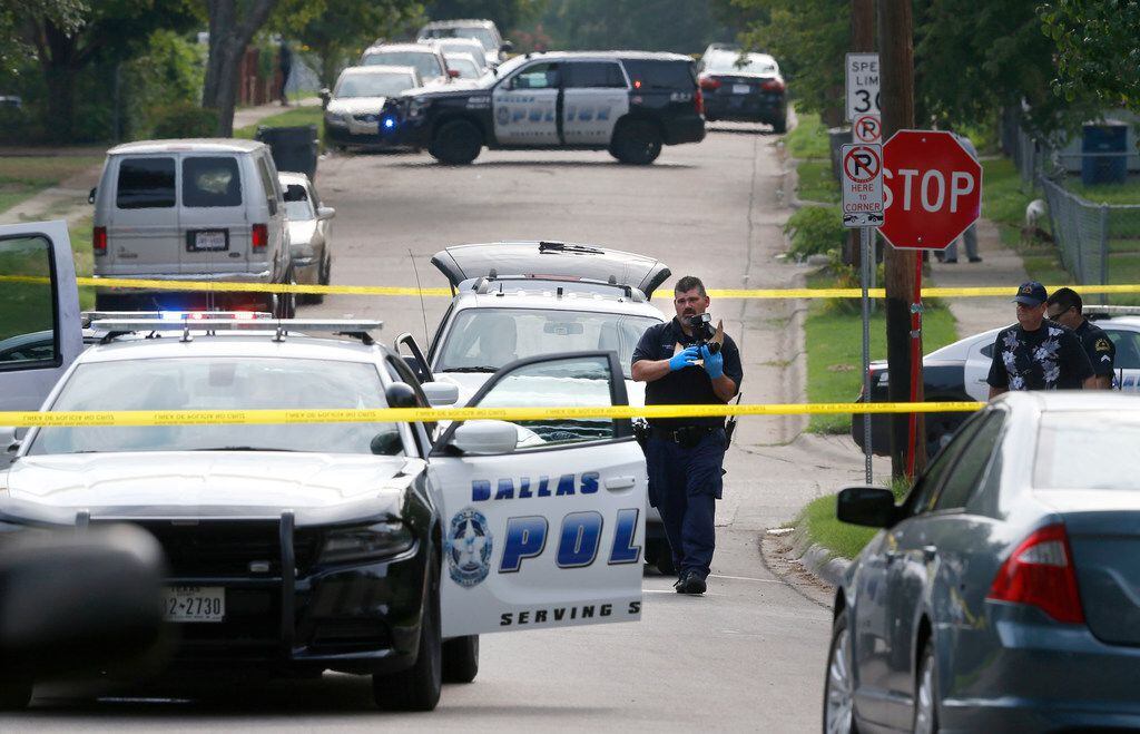 Dallas police investigate after a Dallas police officer was injured close to the...
