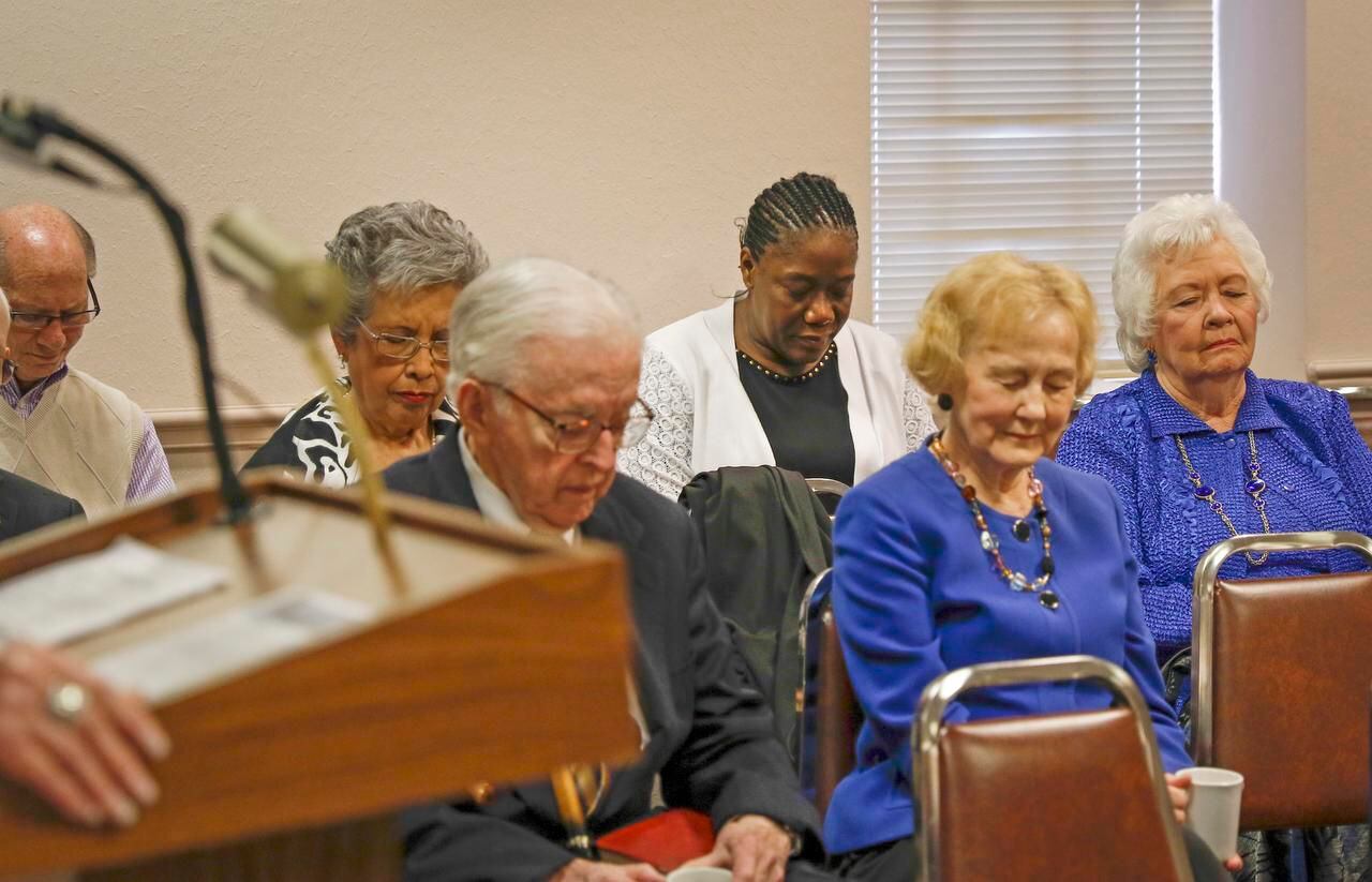 
Louise Troh (center) prayed during a Bible study class at Wilshire Baptist Church on...