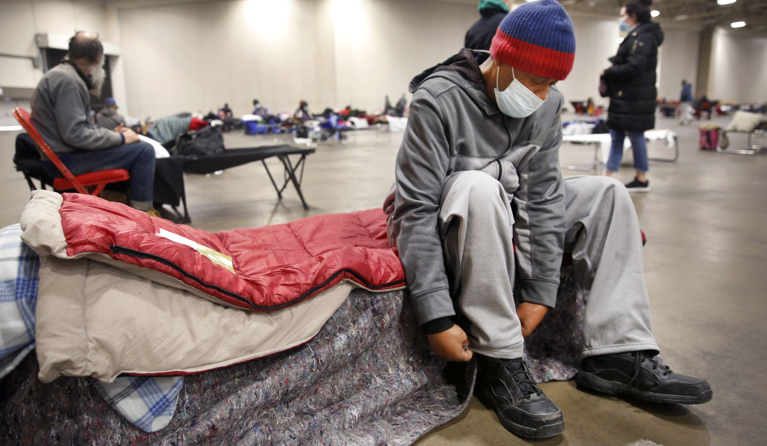 Pierre Scott, a 59 year-old guest and volunteer at a warming center run by OurCalling,...