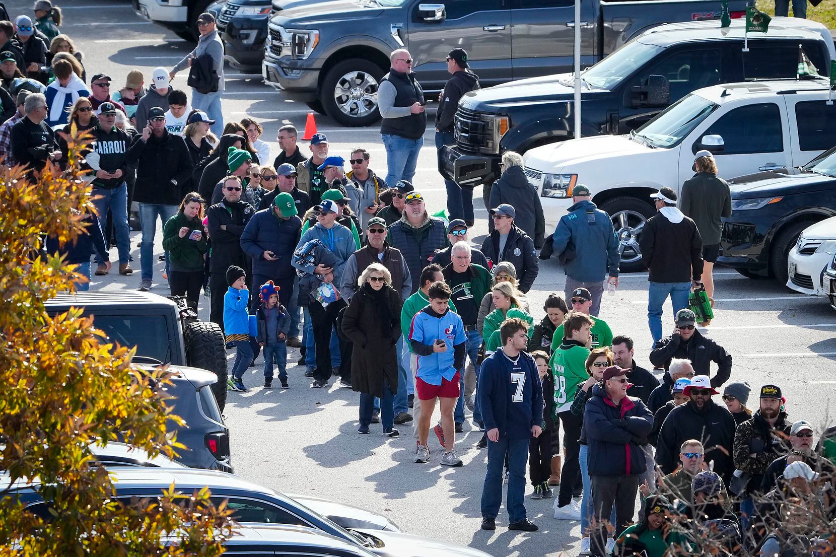 Fans wait in a long line to enter the stadium before the Class 6A Division II Region I final...