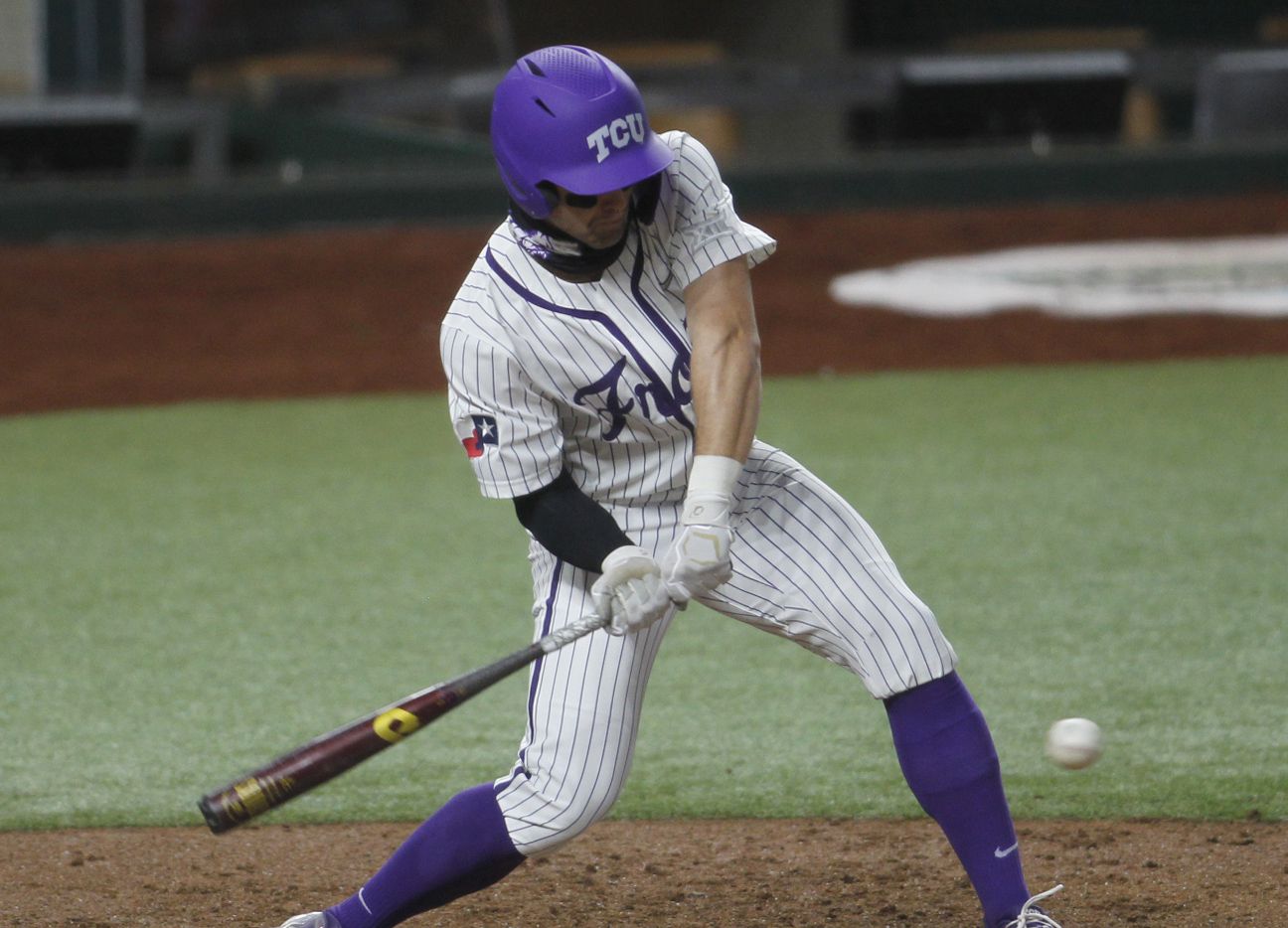TCU center fielder Hunter Wolfe (6) is unable to connect or hold up on his swing as he is called out on strikes during the bottom of the 3rd inning of play against Arkansas. Texas Christian University played the University of Arkansas in conjunction with the State Farm College Baseball Showdown tournament held at Globe Life Field in Arlington on February 22, 2021.