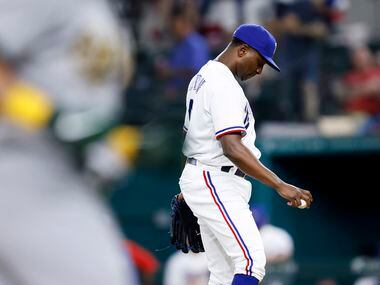 Texas Rangers relief pitcher Jharel Cotton (45) reacts after giving up a home run to Oakland...