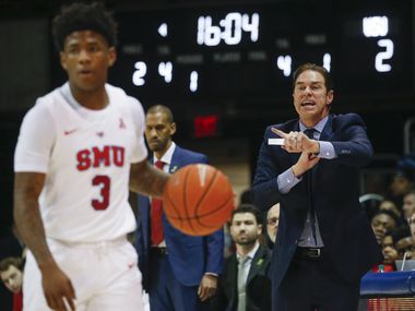 Southern Methodist Mustangs head coach Tim Jankovich calls out a play as Southern Methodist Mustangs guard Kendric Davis (3) waits for the offense to set during the first half of am NCAA men's basketball matchup between SMU and Wichita State on Sunday, March 1, 2020 at Moody Coliseum in University Park, Texas.