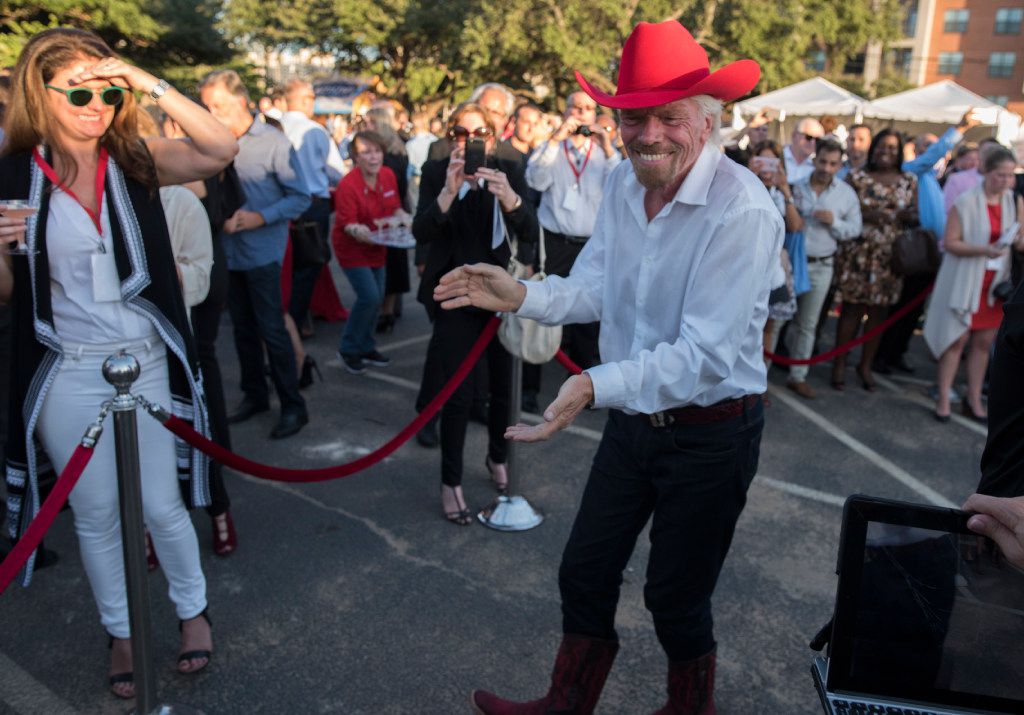 Richard Branson dances to country music after the ground breaking for his Virgin Hotel in...