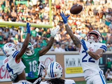 SMU safety Nick Roberts (22) breaks up a pass intended for UNT wide receiver Jyaire Shorter...