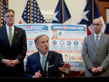 Texas Gov. Greg Abbott, flanked by Lt. Gov. Dan Patrick, left, and House Speaker Dennis Bonnen, speaks during a press conference at the state Capitol about the state's response to the coronavirus on Tuesday, March 31, 2020, in Austin, Texas.
