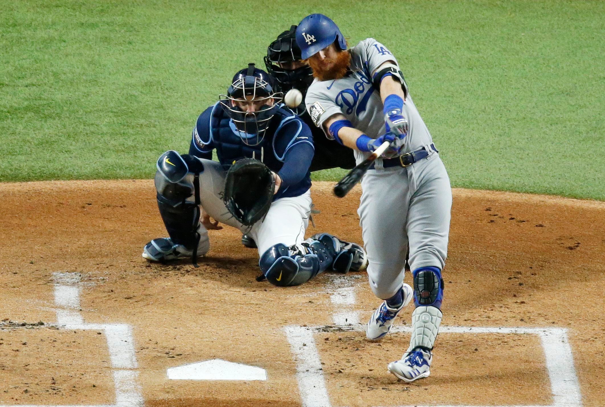 Photos: Randy Arozarena lays on home plate after game-winning run