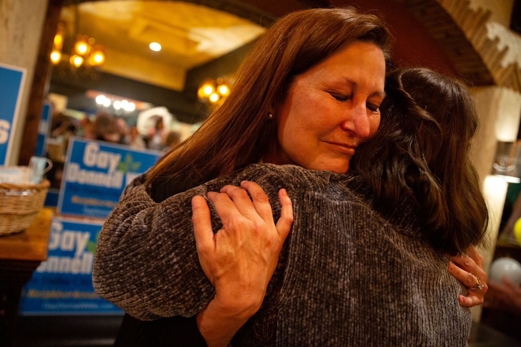 Gay Donnell Willis hugs her step daughter Melissa Willis at her runoff election watch party...