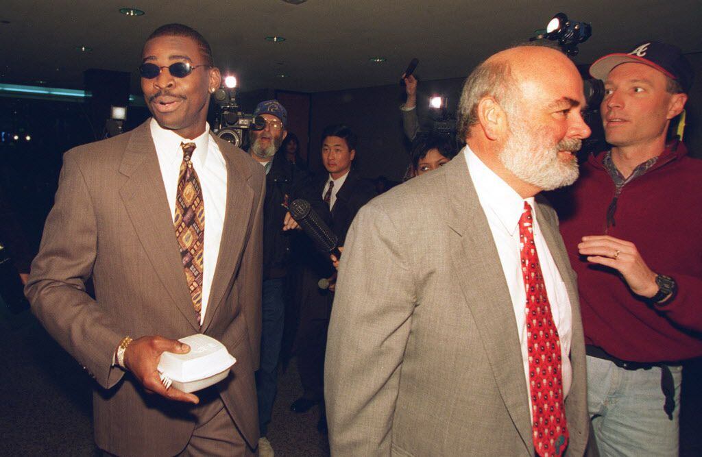3-28-1996...Michael Irvin (L), walks with his attorney Kevin Clancy, (R), Thursday, at the...