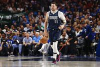 Dallas Mavericks guard Luka Doncic (77) dribbles the ball up court during the second half of...