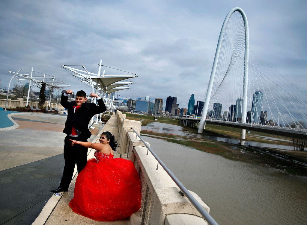 Ari Hernandez of Denton poses for quinceañera photos with her date, Neven Campos, at the Margaret Hunt Hill Bridge.