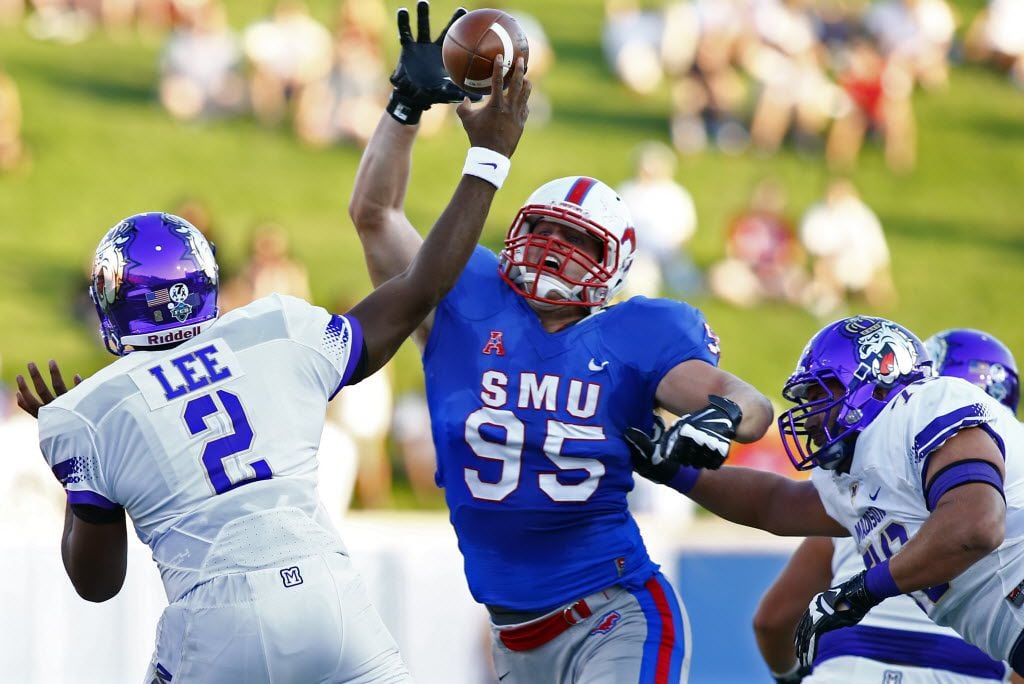 
SMU defensive lineman Andrew McCleneghen (95) pressures James Madison quarterback Vad Lee (2) in the first half of their college football game at Gerald J. Ford Stadium in Dallas, Texas, Saturday, September 26, 2015. Garland defeated Sachse 38-34. Mike Stone/Special Contributor