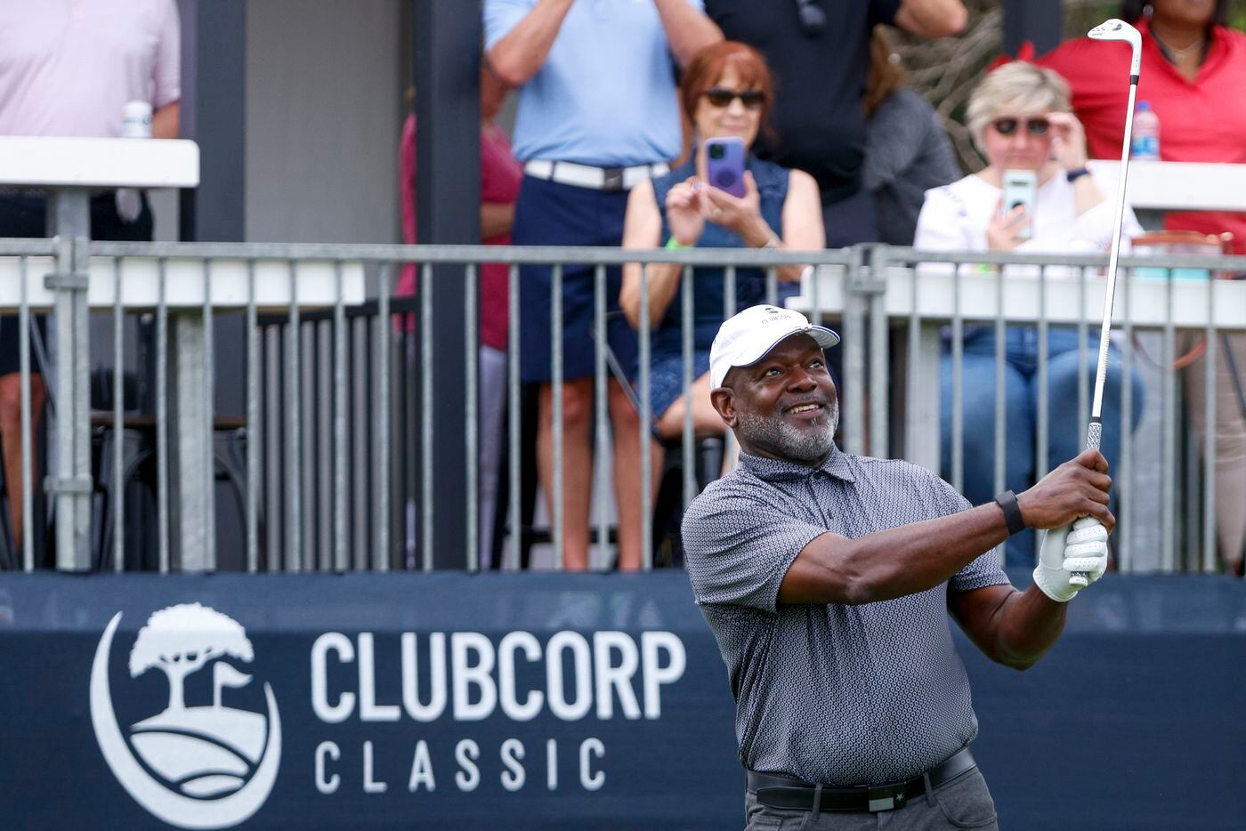 Former Dallas Cowboys player Emmitt Smith watches his tee shot on the 17th hole during the...