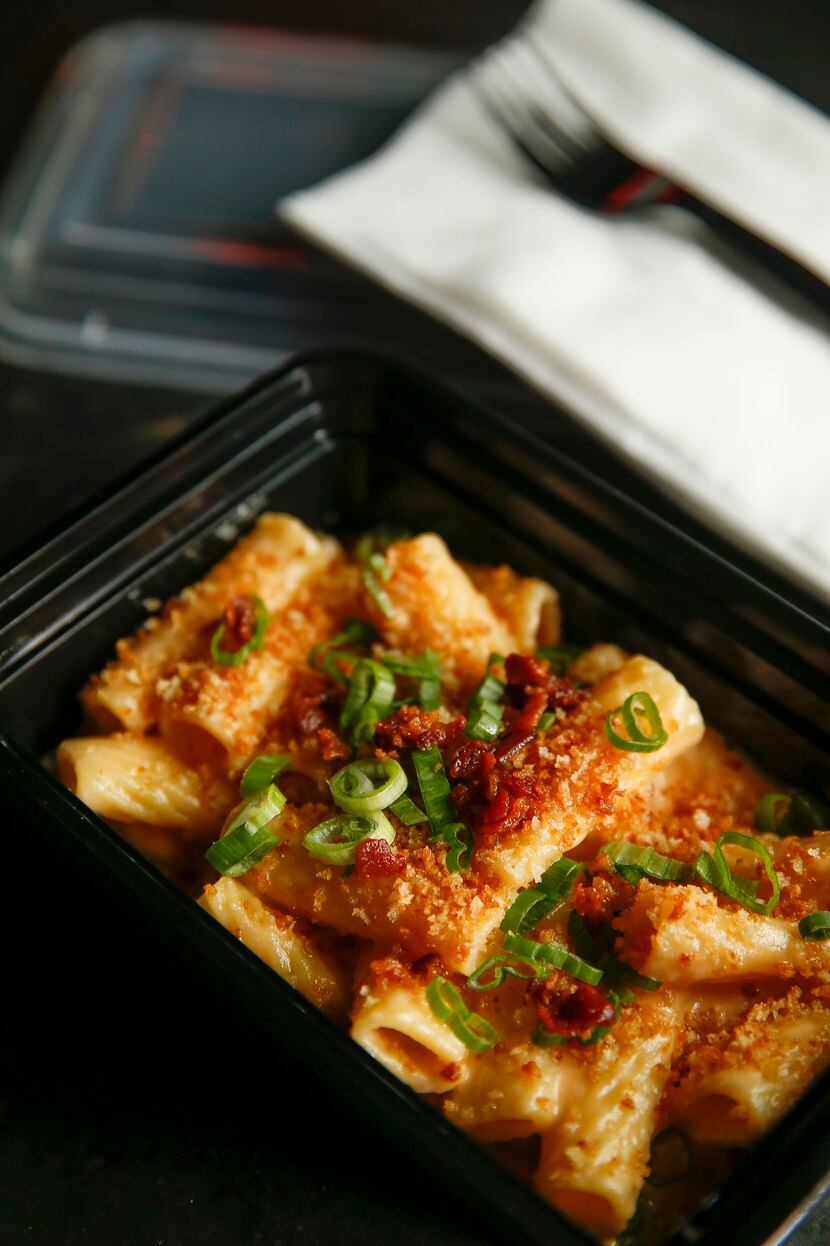 Habanero mac and cheese is seen in a take out container at Brick and Bones on Tuesday, May...