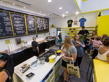 Members of the press and friends of the owner, Kari Seher, enjoy ice cream treats at Melt...