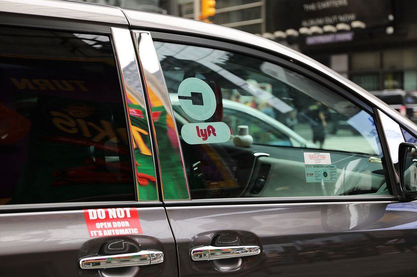 NEW YORK, NY - JULY 30:  A Lyft ride hailing vehicle moves through traffic in Manhattan on...