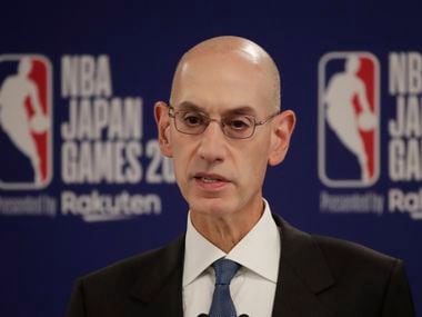 FILE - In this Oct. 8, 2019 file photo, NBA Commissioner Adam Silver speaks at a news conference before an NBA preseason basketball game between the Houston Rockets and the Toronto Raptors in Saitama, near Tokyo. When major corporations have angered Chinese authorities in recent years, the playbook calls for one thing: an apology.  The NBA, with billions at stake, has resisted that for now, though some experts wonder if such a move is inevitable.