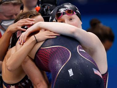 USA’s Regan Smith, Torri Huske, and Lydia Jacoby console an emotional Abbey Weitzeil after...
