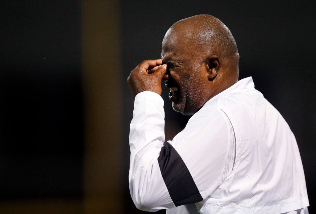 Duncanville head coach Reginald Samples winces as he watches his players performance against...