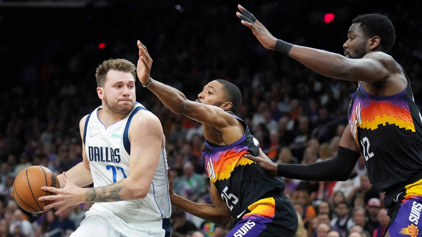 Dallas Mavericks guard Luka Doncic (77) drives to the basket against Phoenix Suns forward...