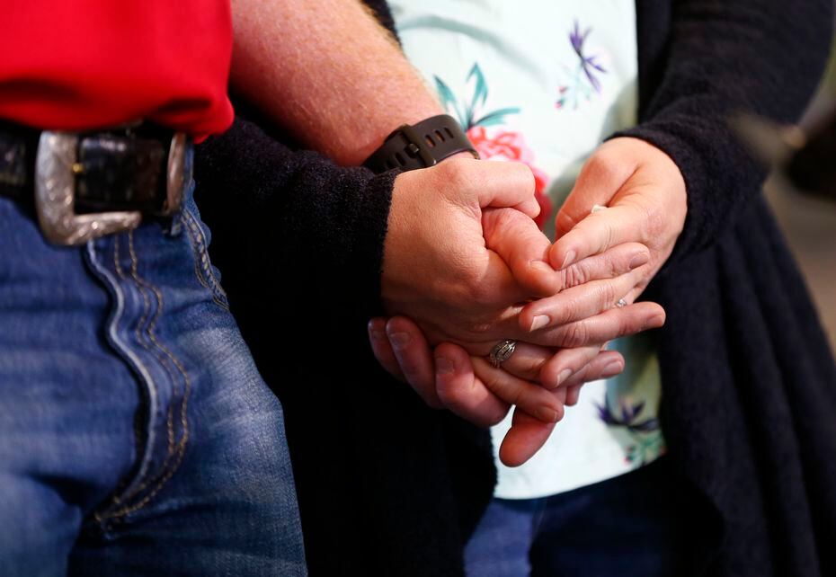 Andrew Needum and his wife Stephanie Needum held hands as they talked about their experience on Southwest Airlines Flight 1380. (Nathan Hunsinger/The Dallas Morning News)