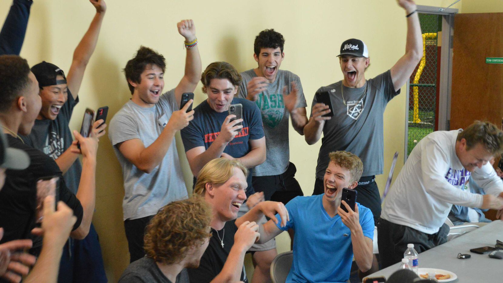 Frisco Reedy baseballer Jordan Viars celebrates with family and friends after learning of...