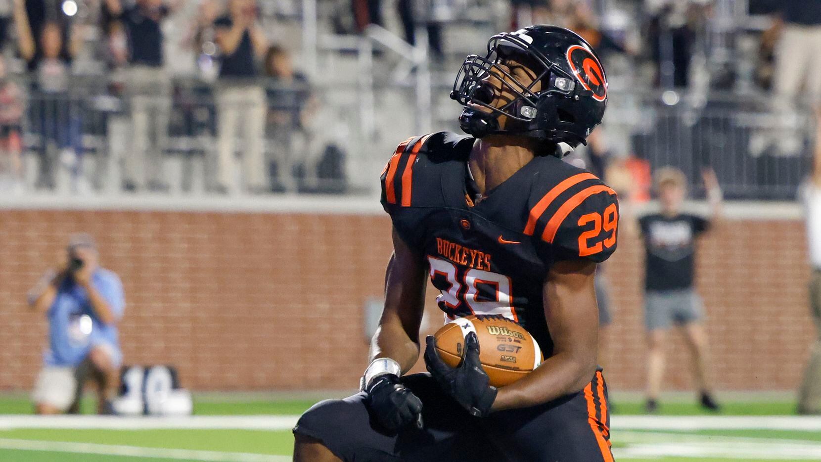 Gilmer running back Ashton Haynes (29) celebrates after scoring a touchdown during the first...